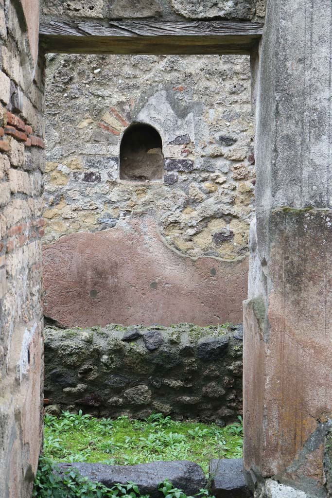 VIII.4.4, Pompeii. December 2018.
Doorway to room 7, kitchen. Looking towards east wall with niche.
Photo courtesy of Aude Durand.