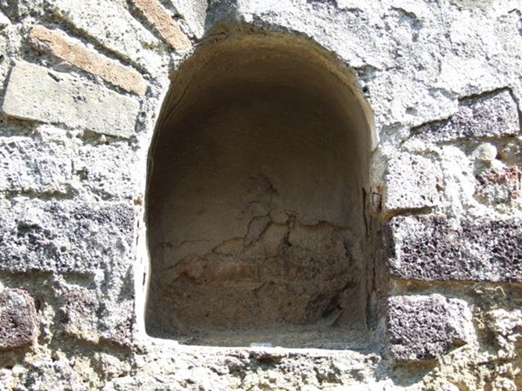 VIII.4.4 Pompeii. March 2009. Room 7, niche on east wall of kitchen.
According to Boyce, this small arched niche was above a masonry tub and adorned with an aedicula façade.
See Boyce G. K., 1937. Corpus of the Lararia of Pompeii. Rome: MAAR 14. (p.76)
See Giacobello, F., 2008. Larari Pompeiani: Iconografia e culto dei Lari in ambito domestico. Milano: LED Edizioni. (p.199)
