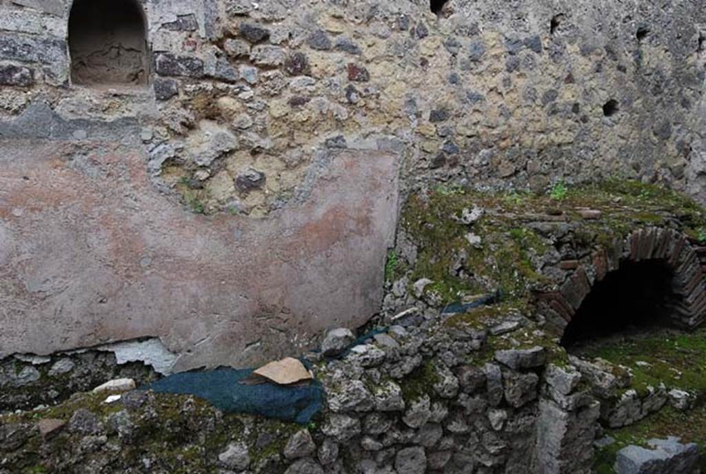 VIII.4.4 Pompeii. April 2009. Looking towards east wall, niche, masonry structure and hearth. Photo courtesy of Nicolas Monteix.