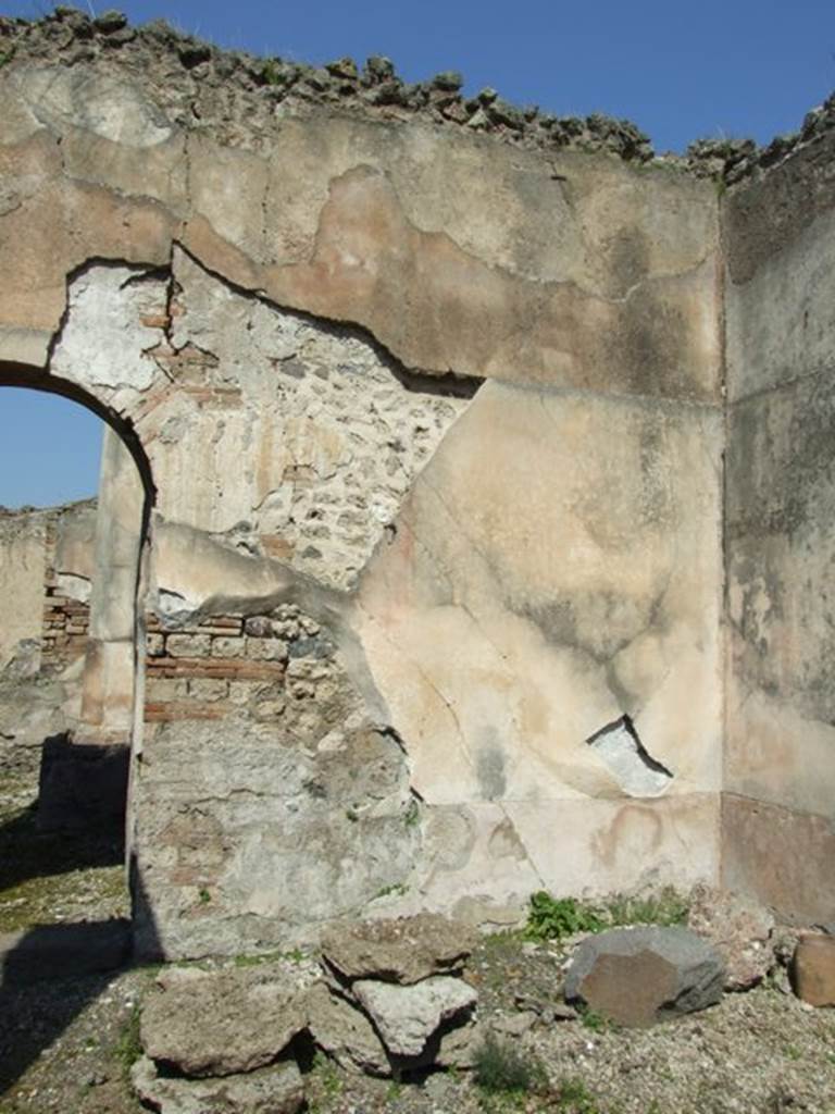 VIII.4.4 Pompeii. March 2009. Room 9. East portico. Remains of wall plaster in north east corner.