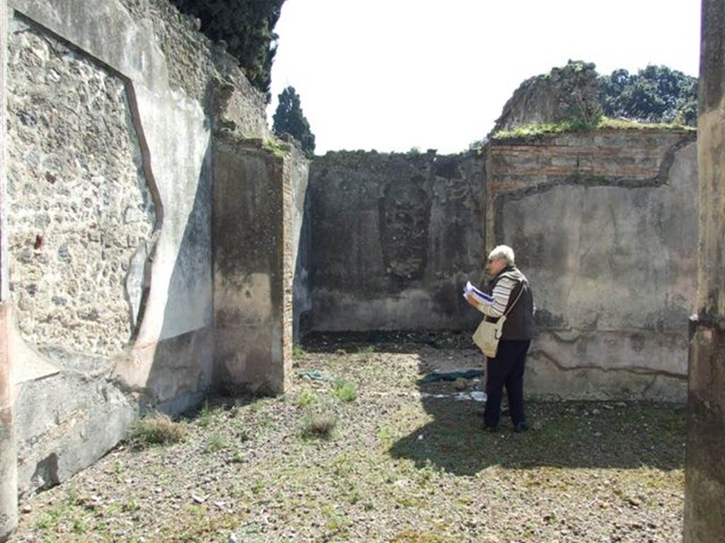 VIII.4.4 Pompeii. March 2009. Looking south across south portico to doorway of Room 10, Triclinium.