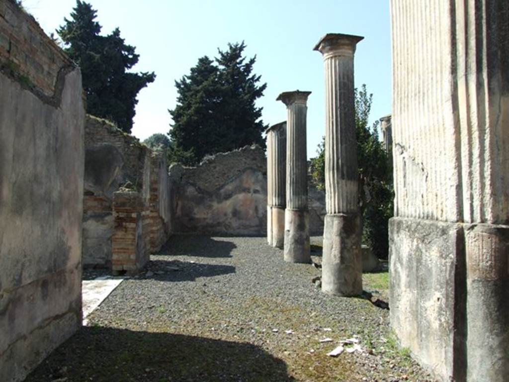 VIII.4.4 Pompeii. March 2009. Looking west along south portico, and with the marble sill of room 11, Exedra, on the left.