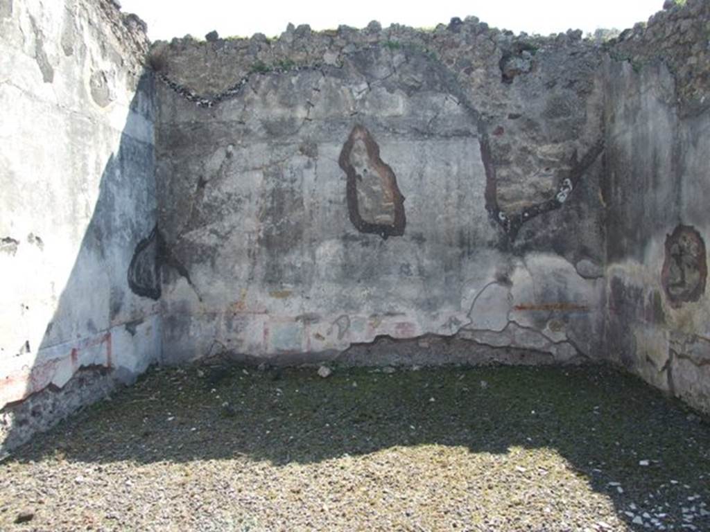 VIII.4.4 Pompeii. March 2009. Room 11, south wall of exedra. In the centre of the south wall, would have been the painting of Narcissus looking at himself in the water. When found the painting was very damaged due to the hole left by the ancient searchers who had penetrated into the house after the eruption. Only the feet of a young man and two cupids could be distinguished. However, it was recognised that the subject was Narcissus.
See Fiorelli, Giornale degli Scavi, 1861, (p.84).
See Helbig, W., 1868. Wandgemälde der vom Vesuv verschütteten Städte Campaniens. Leipzig: Breitkopf und Härtel. (1356)
See Breton, Ernest. 1870. Pompeia, Guide de visite a Pompei, 3rd ed. Paris, Guerin.
See Pappalardo, U., 2001. La Descrizione di Pompei per Giuseppe Fiorelli (1875). Napoli: Massa Editore. (p.127)