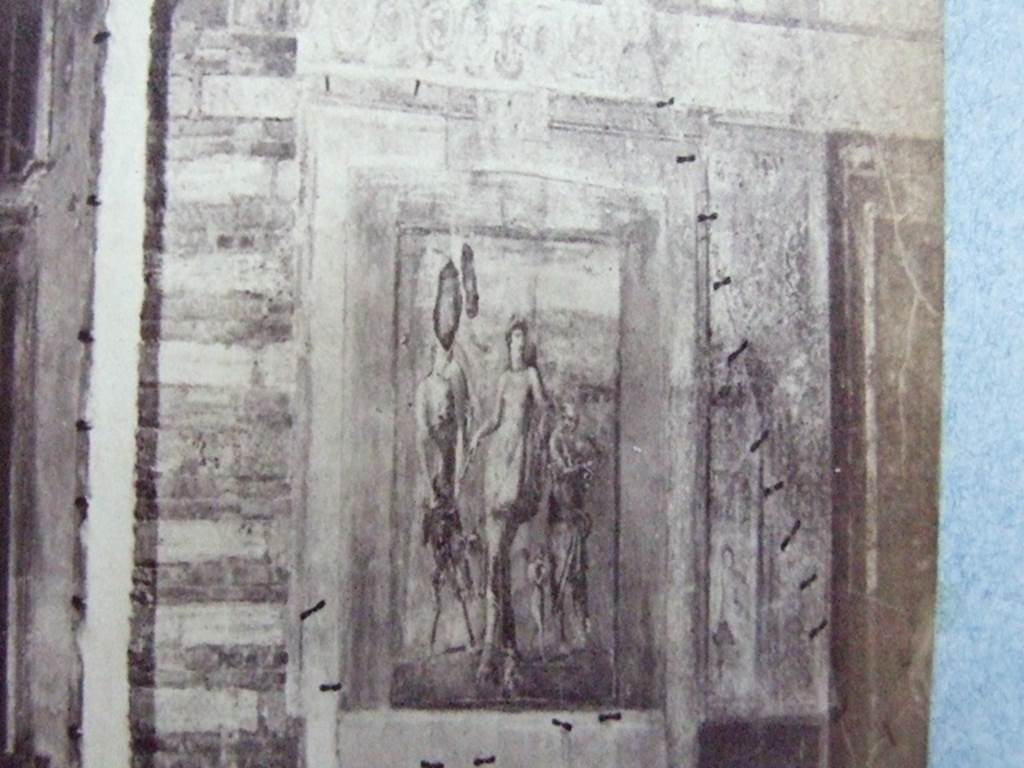 VIII.4.4 Pompeii. Room 11, east wall of exedra, detail of painting in exedra at rear of peristyle.
Hermaphrodite has his left arm on the shoulder of Silenus who is playing the lyre with a plectrum.
Courtesy of Society of Antiquaries, Fox Collection.