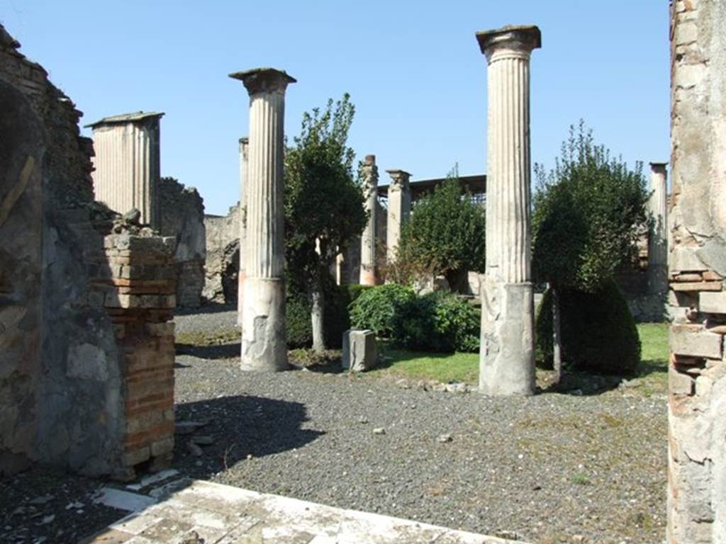 VIII.4.4 Pompeii. March 2009. Room 11, exedra. Looking north from door threshold.
View across garden, including the base of the fountain statuette shown in the pictures below.
According to Dyer:
“Over the roof of the portico, supported by the pillars, ran a gallery with another set of columns, reached by a staircase near the tablinum.
The peristyle is simply decorated.
The lower third of the columns having the channelling only marked with lines, is painted red, while the upper (and channelled part) is white.
The walls are black, and adorned with small pictures of eatables, separated by ornaments.
The border at the bottom is painted with water-plants and water-fowl.
On the wall on the right (of the peristyle) was a graffito, to the following effect:
“July 7th, lard 200lb, garlic 250 bundles” meaning probably that these things were either bought or sold on that day.”
See Dyer, Thomas, 1867: The Ruins of Pompeii. London: Bell and Daldy, (p.80).