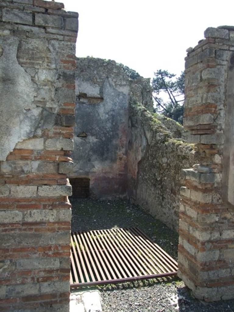 VIII.4.4 Pompeii. March 2009. Doorway to room 12, looking south. According to Helbig, this room contained the following paintings: Europa (128), Light Gods? (964) and Nereide (1030)
See Helbig, W., 1868. Wandgemälde der vom Vesuv verschütteten Städte Campaniens. Leipzig: Breitkopf und Härtel.