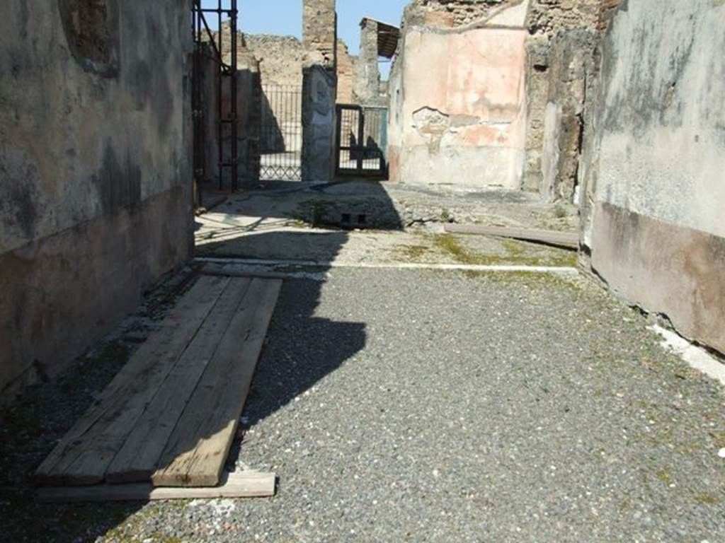 VIII.4.4 Pompeii. March 2009. Room 20, looking north through tablinum to atrium and front entrance. According to Fiorelli, when excavated only one painting remained, showing Venus and Adonis sitting and looking at a nest of three cupids. He said they had also found a fragment of the other painting that had a sitting Endymion. See Pappalardo, U., 2001. La Descrizione di Pompei per Giuseppe Fiorelli (1875). Napoli: Massa Editore. (p.126) According to the Giornale di Scavi 1861, see page 42: In the tablinum …….. is shown Leda showing Tindarus the twins and Helen just come out of the egg.