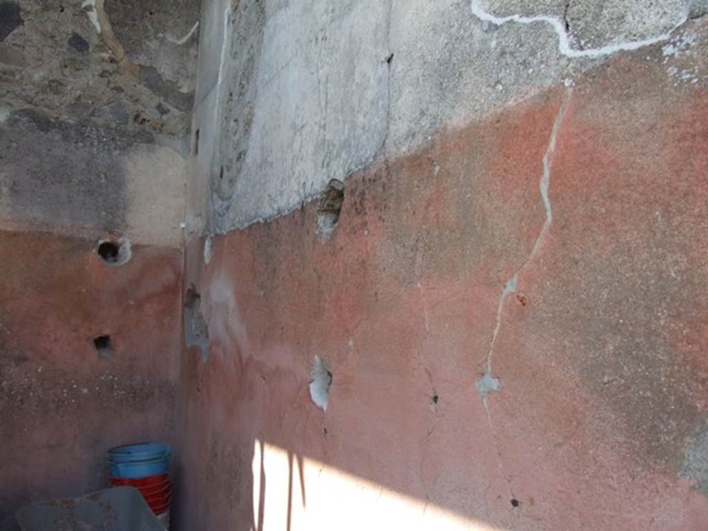 VIII.4.4 Pompeii. March 2009. Room 21, north-west corner of ala or cupboard. Shelving support holes in west and north walls.