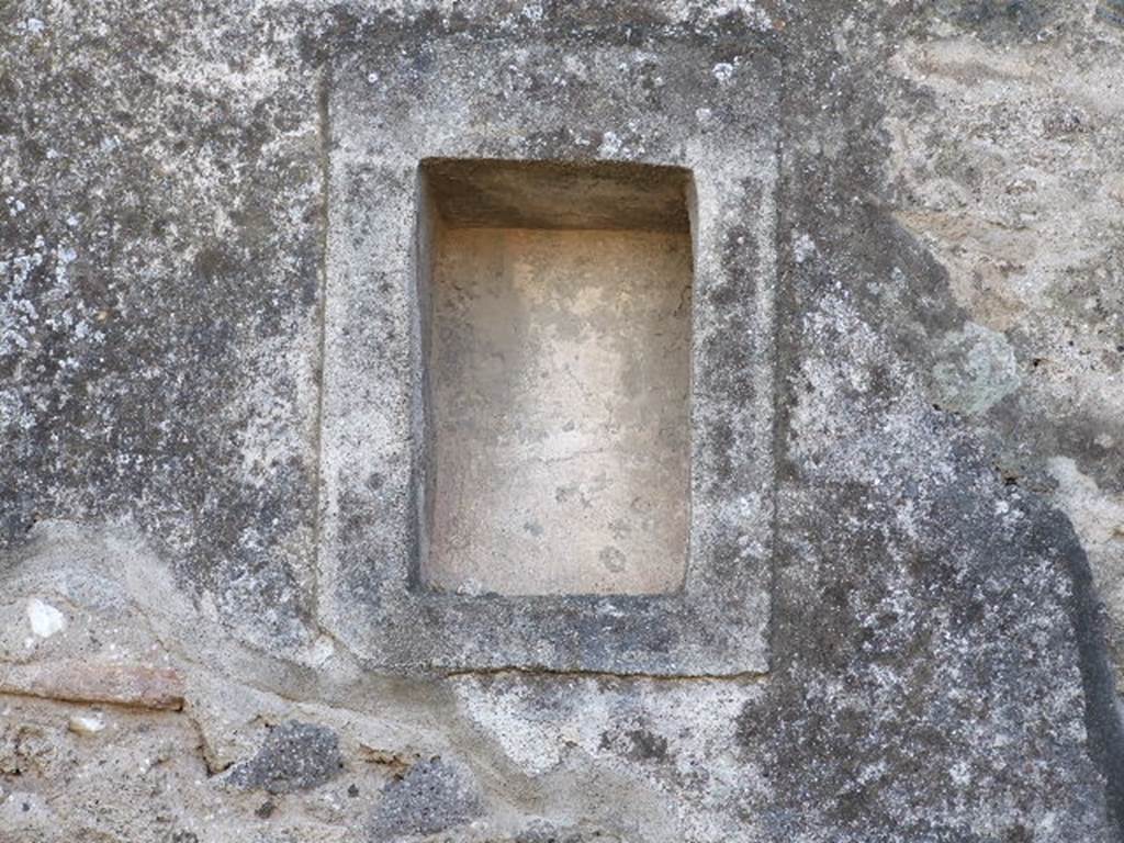 VIII.4.5 Pompeii. December 2006. Niche in south wall of shop. Boyce described this niche as a small rectangular niche adorned with an aedicula façade.
See Boyce G. K., 1937. Corpus of the Lararia of Pompeii. Rome: MAAR 14. (p.76)