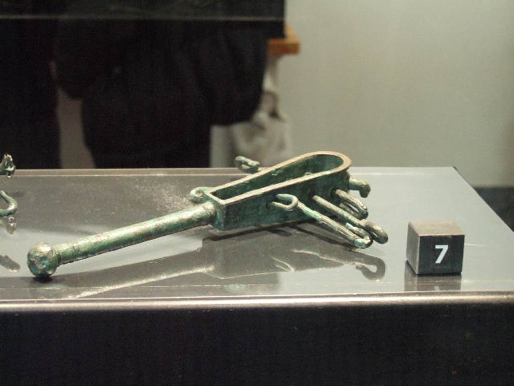Bronze sistrum found in VIII.4.5. Now in Naples Archaeological Museum.