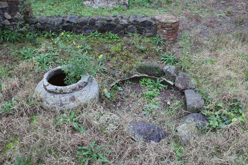 VIII.4.12, Pompeii. December 2018.
Detail of items near south side of peristyle. Is this the masonry pool, as described by Jashemski. Photo courtesy of Aude Durand.