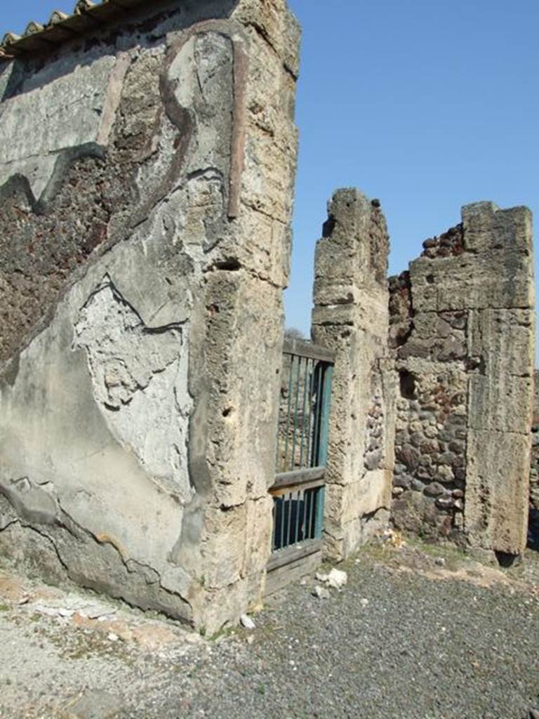 VIII.4.15 Pompeii. March 2009. Doorway to shop at VIII.4.16, in north east corner of atrium.