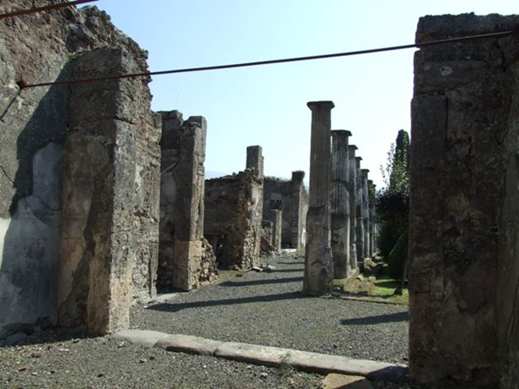 VIII.4.15 Pompeii. March 2009. Room 5. Oecus. Looking south from doorway, onto north and east portico of garden.