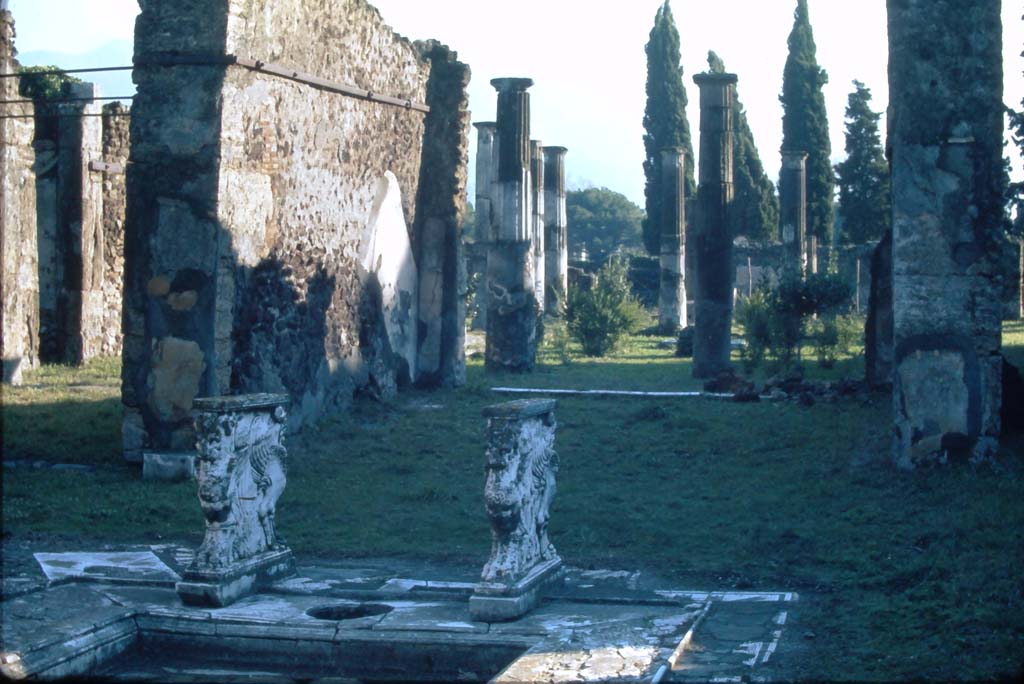VIII.4.15 Pompeii. 4th December 1971. Looking south across impluvium in atrium towards east wall of tablinum.
Photo courtesy of Rick Bauer, from Dr George Fay’s slides collection.