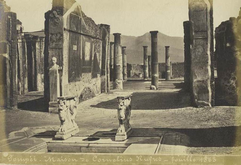 VIII.4.15 Pompeii. Undated photograph by Mauri, numbered 014. Looking south across impluvium towards decorated east wall of tablinum. Photo courtesy of Rick Bauer.