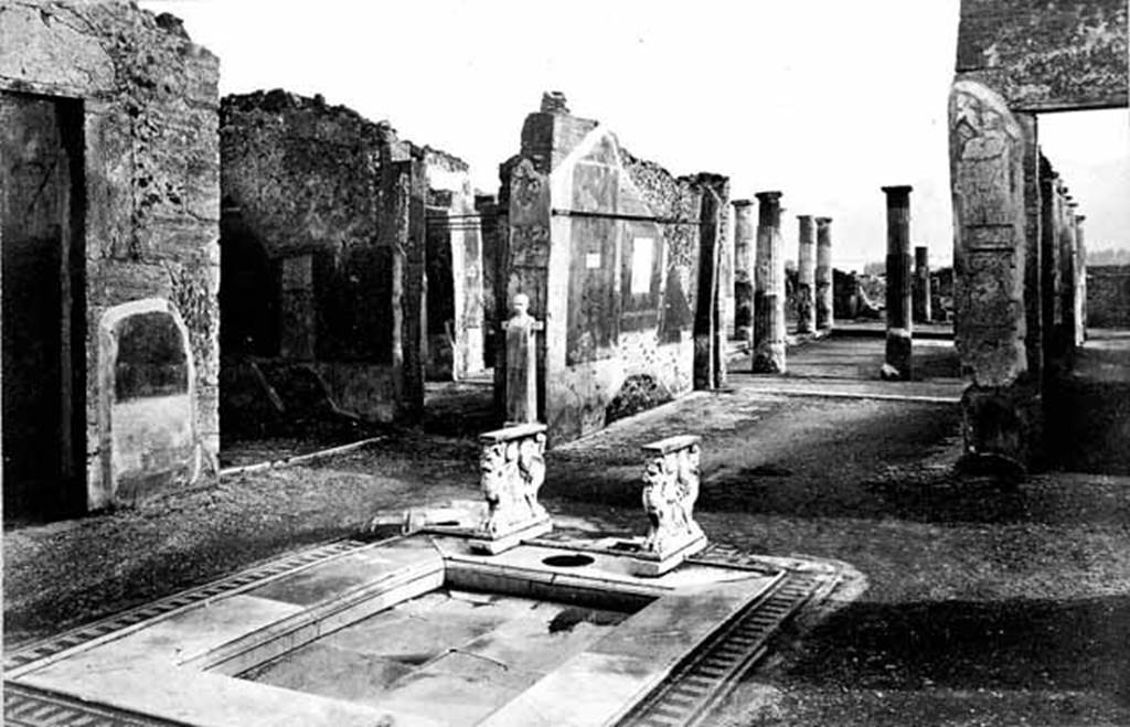 VIII.4.15 Pompeii. Photo taken c.1870. Looking south from atrium towards tablinum. Note the beautiful marble surround to the impluvium. Photo courtesy of Rick Bauer.