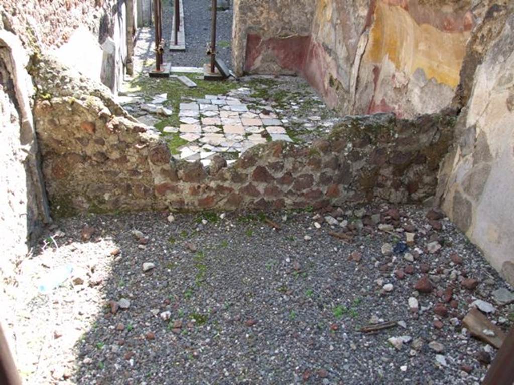 VIII.4.15 Pompeii. March 2009. Room 7, a small room or cupboard in foreground. Room 18 is beyond the ruined wall. Looking south.