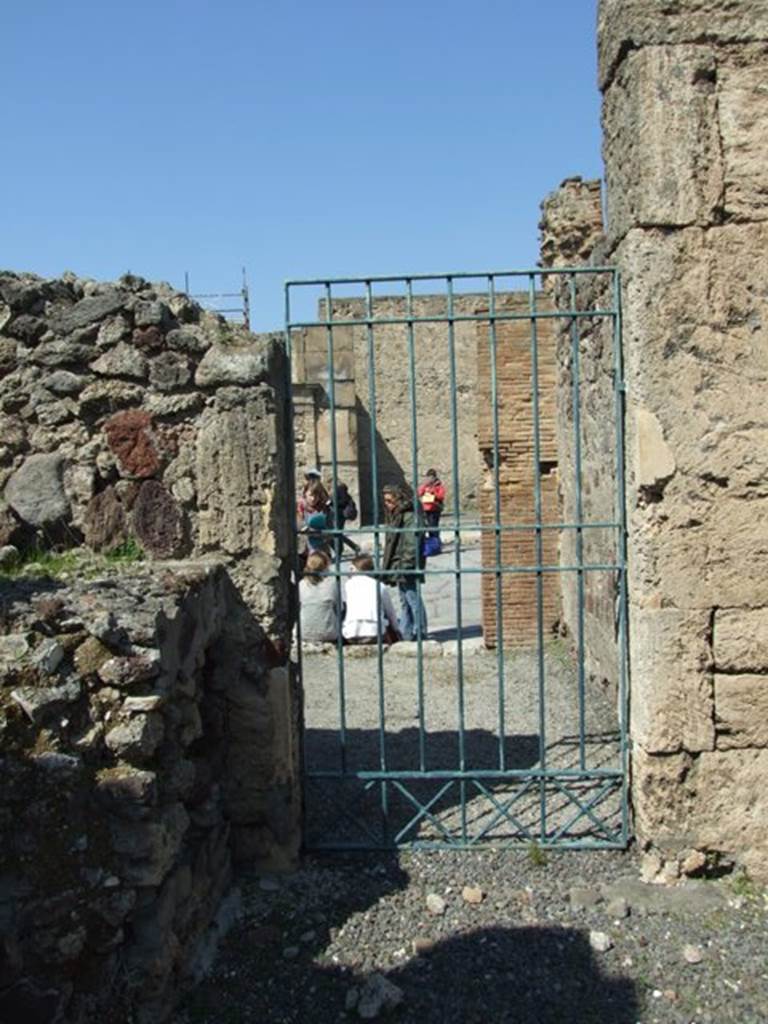 VIII.4.15 Pompeii. March 2009. Room 1, atrium. North-west corner and door to shop at VIII.4.14