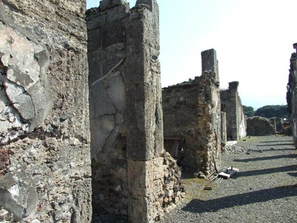 VIII.4.15 Pompeii. March 2009. Doorways to room 12 and 13 on east portico. Looking south.