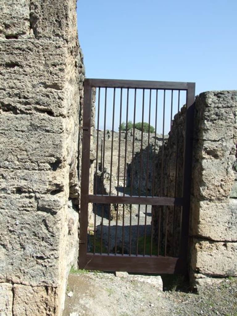 VIII.4.15 Pompeii. March 2009. Doorway to VIII.4.23, and Via Stabiana. Looking east.