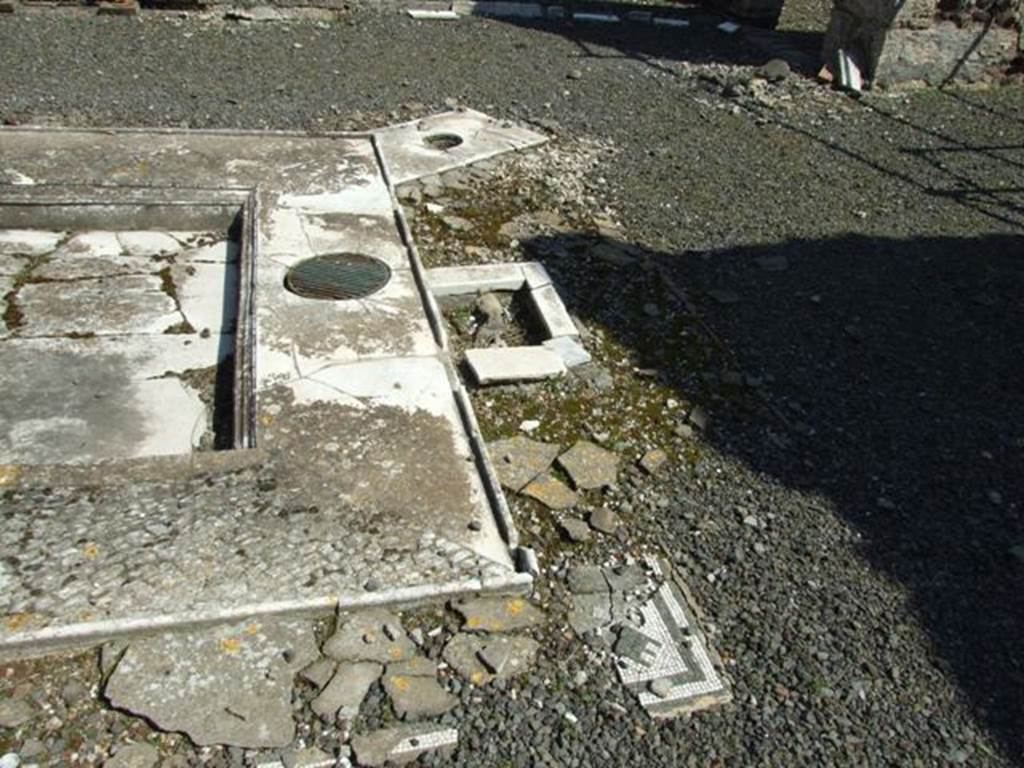 VIII.4.15 Pompeii. March 2009. Room 1, impluvium in atrium. Looking east across the south side. According to Jashemski, this house was one of many which, after the introduction of the aqueduct, had a fountain in the atrium.
Between the two table supports that stood at the edge of the impluvium there was a round opening which contained the bronze key. This controlled the jet in the middle of the impluvium.
See Jashemski, W. F., 1993. The Gardens of Pompeii, Volume II: Appendices. New York: Caratzas. (p.213)