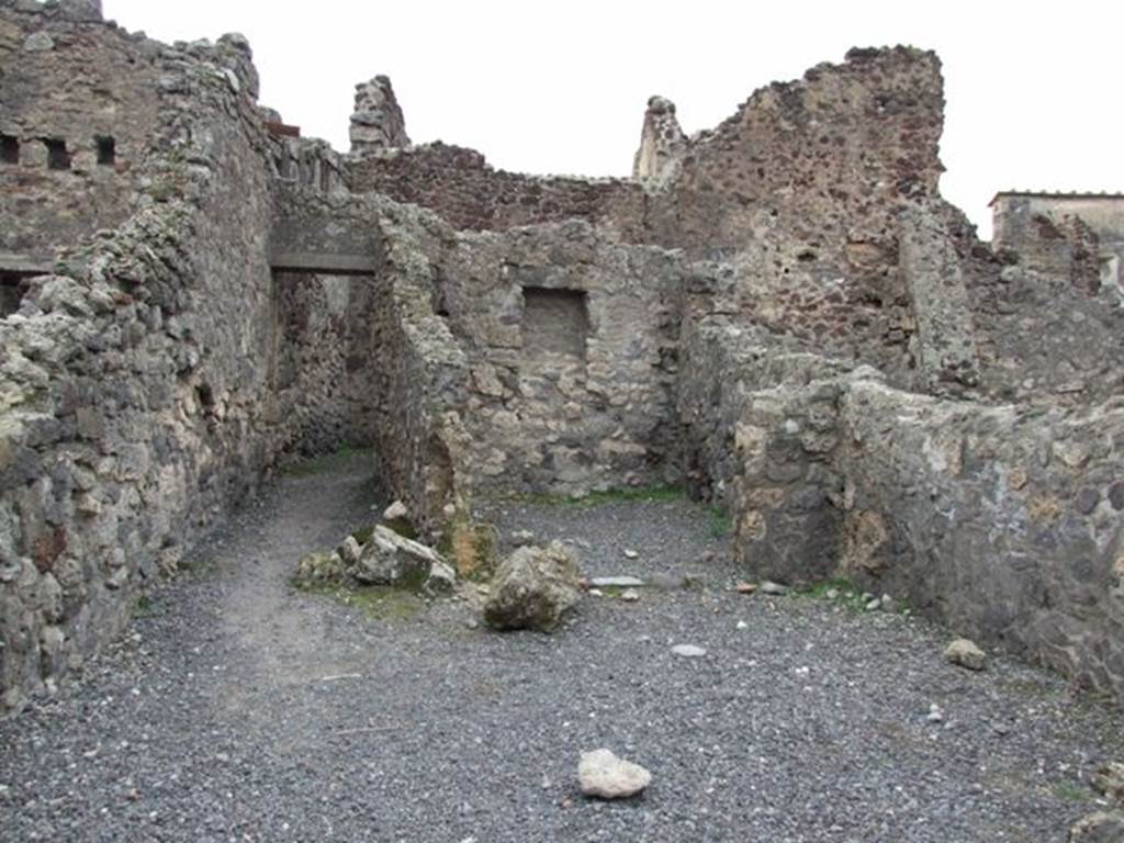 VIII.4.19 Pompeii. Shop and rooms. December 2007. Looking west across shop to room at rear and narrow corridor leading to kitchen.