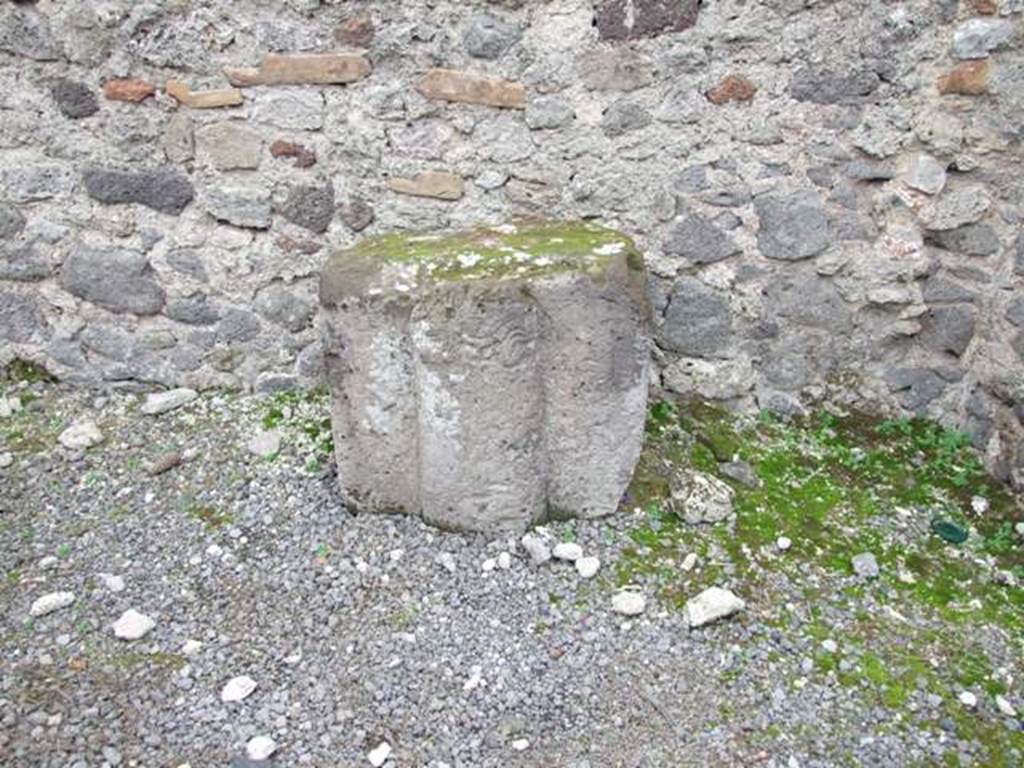 VIII.4.20 Pompeii. Shop and rooms. December 2007. Tufa block with relief.