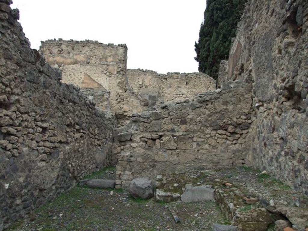 VIII.4.35 Pompeii. Shop and room. December 2007. North wall of shop with room at rear.