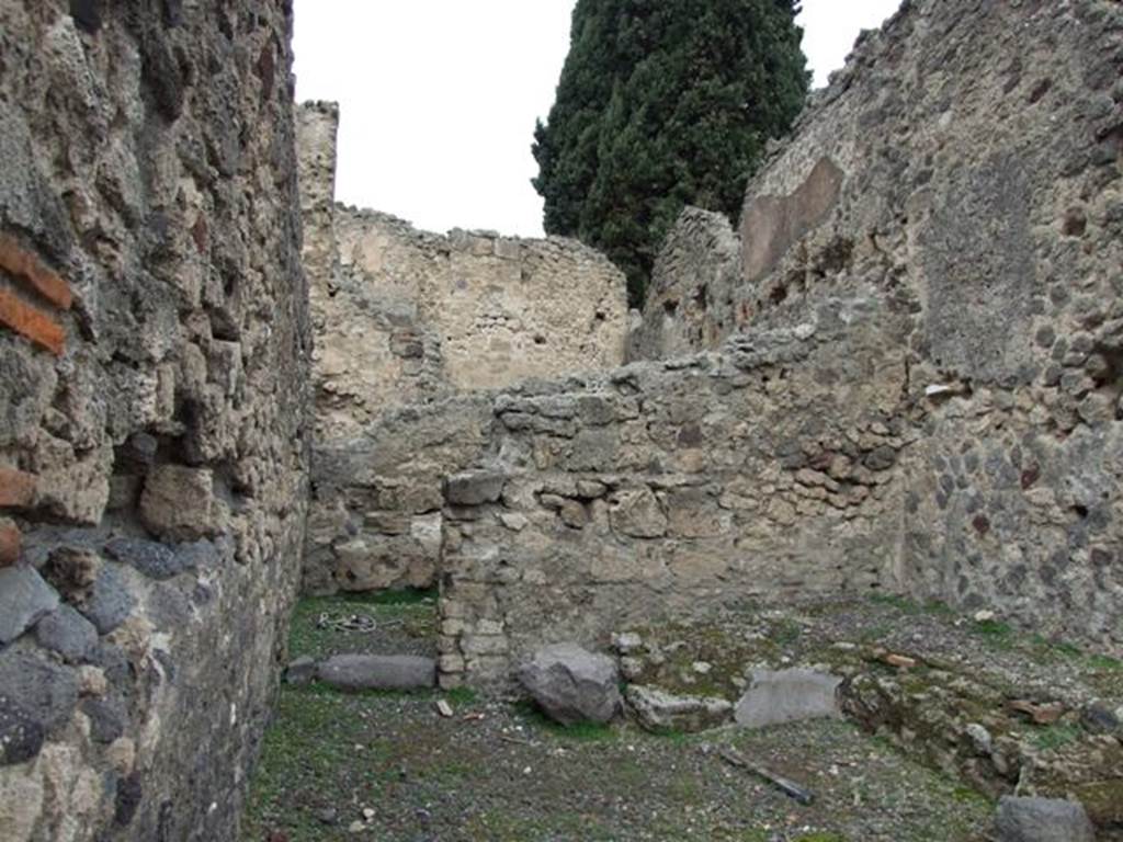 VIII.4.35 Pompeii. Shop and room. December 2007. North wall with door to room at rear.