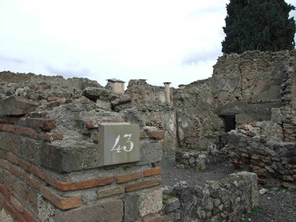 VIII.4.43 Pompeii. Shop. December 2007. North side of entrance with north wall of shop and doorway to VIII.4.44.