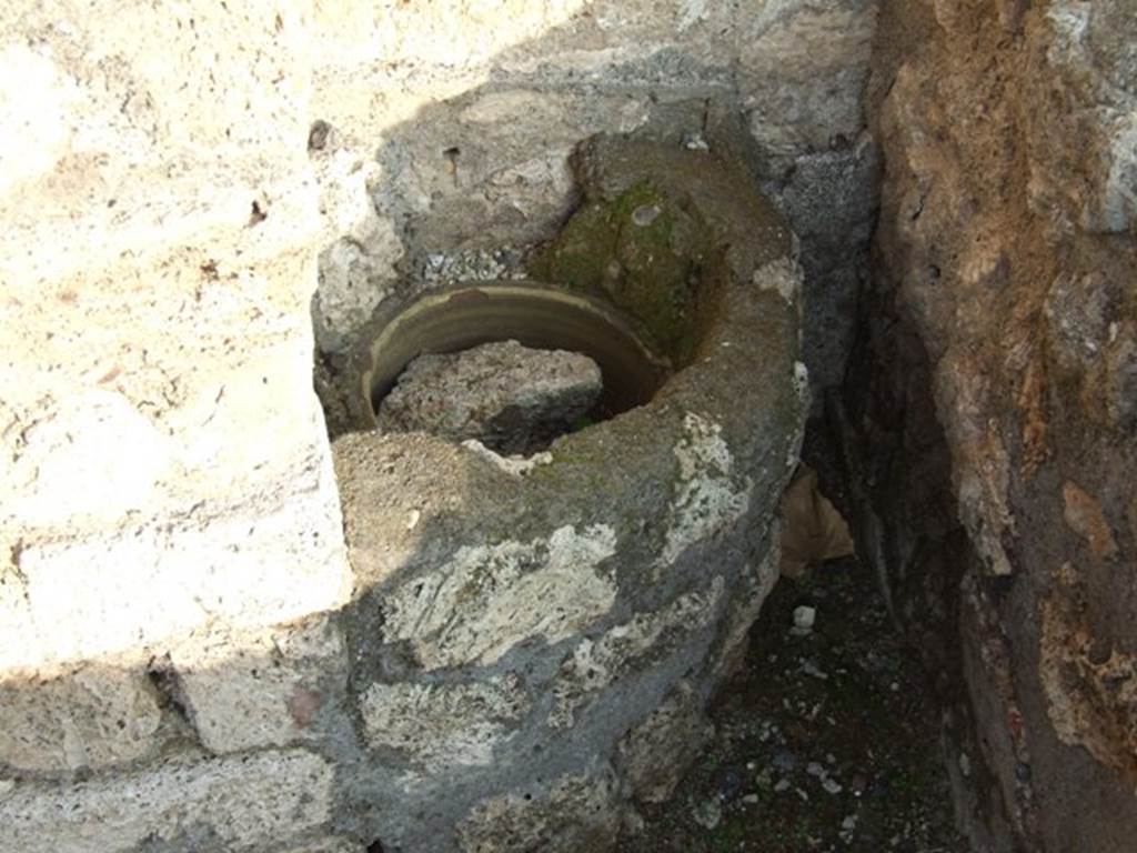 VIII.4.51 Pompeii. December 2007. Pipe with large diameter, in south-east corner of rear room on north side of shop. According to Hobson, this feature may also be for rubbish disposal, as it does not appear to descend from above.
See Hobson, B., 2009. Latrinae et foricae: Toilets in the Roman World. London; Duckworth. (p.93 and fig.115)