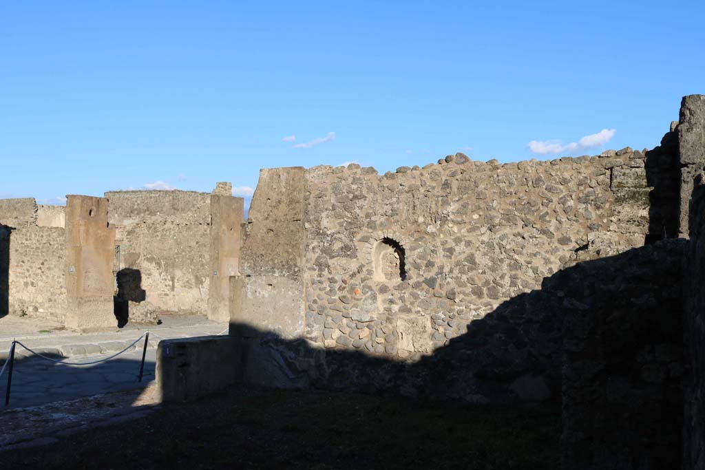 VIII.5.1 Pompeii. December 2018. Looking towards east wall of shop-room, with niche. Photo courtesy of Aude Durand.
