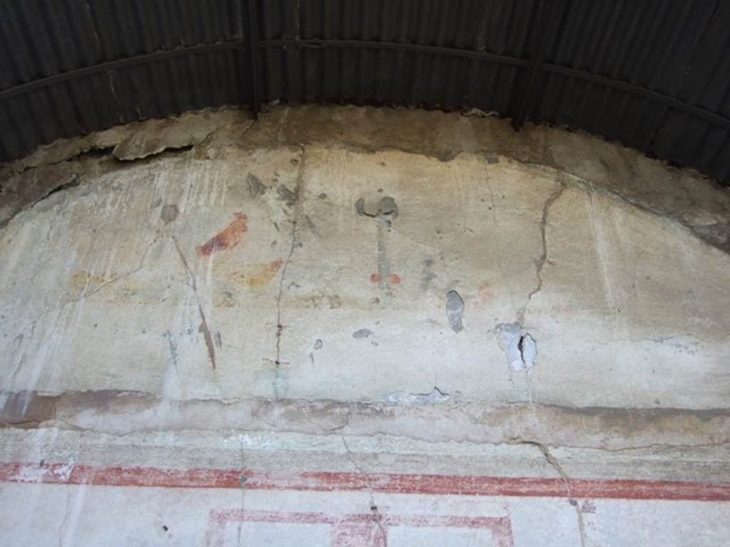 VIII.5.2 Pompeii. March 2009. Room 8, painted plaster on south wall of oecus at rear of peristyle garden. At the top of the wall there was a scene with a cock and a hen between pomegranates, turning to the right towards an altar on which were offerings; on the right there was an overthrown basket with fruit and grapes spilling out, and on which sat a bird and a goose. According to Sampaolo in PPM, this house has taken its name from the recent practice of the staff of Pompeii, to name it after the fresco in this oecus.