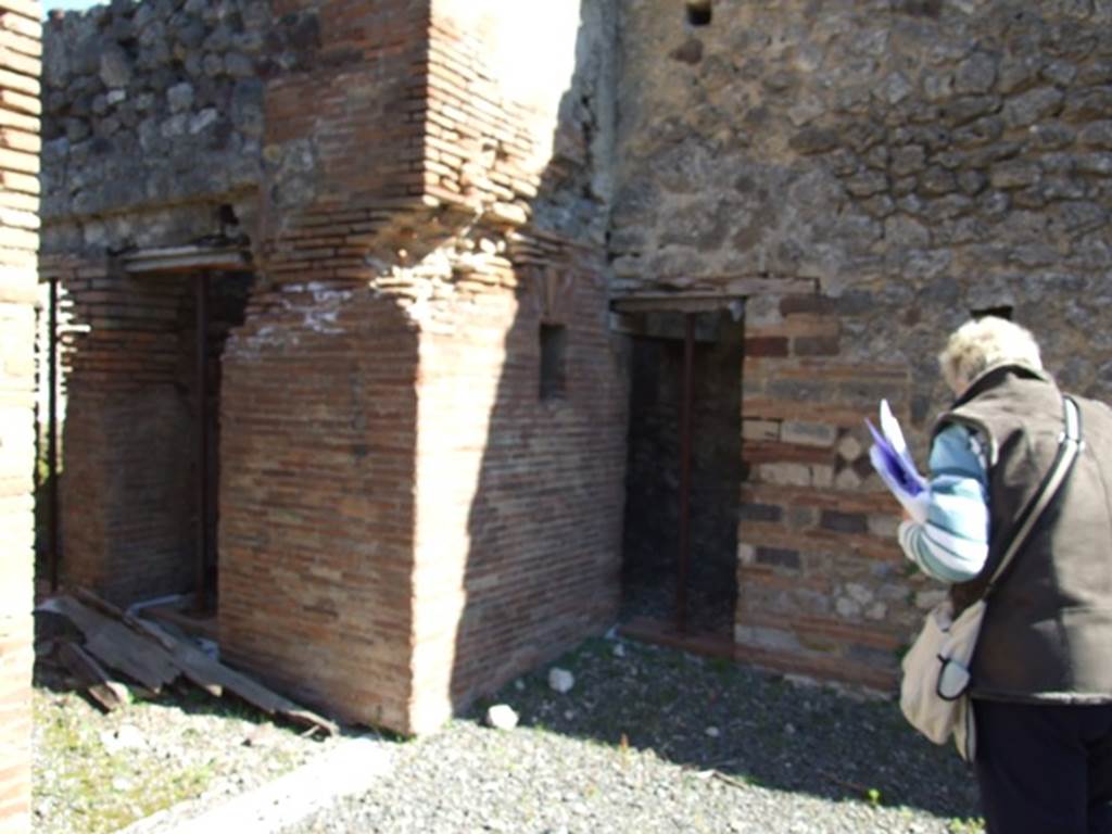 VIII.5.2 Pompeii. March 2009. Doorways to Rooms 21 and 19.