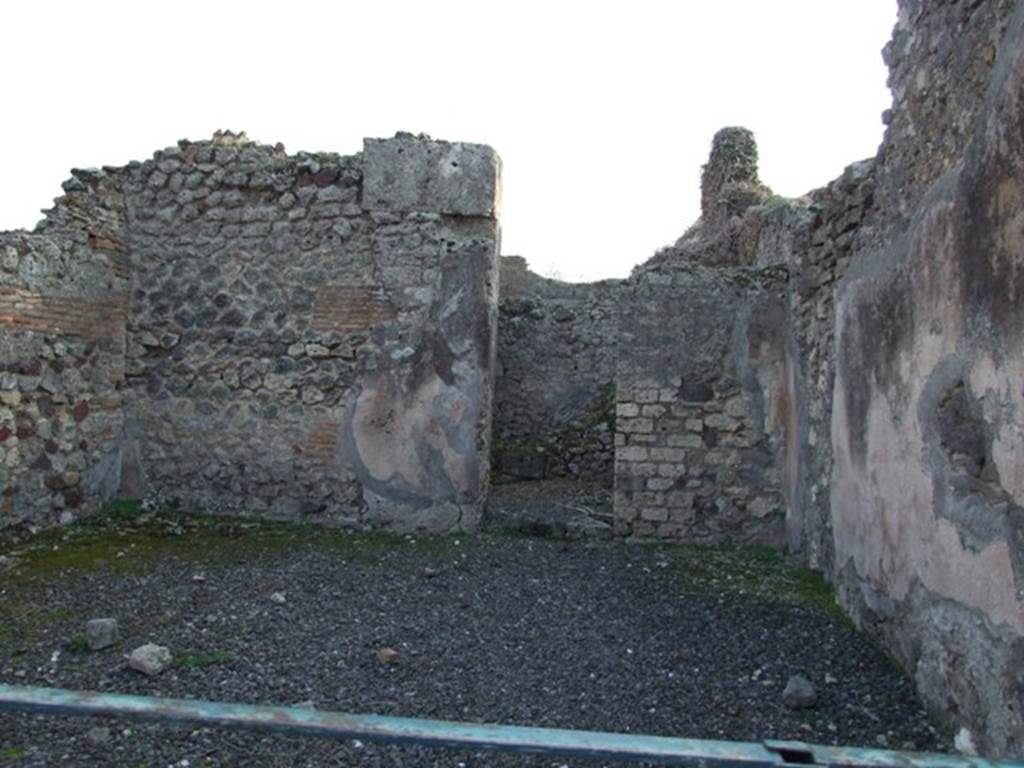 VIII.5.8 Pompeii. Shop. December 2007. South wall with door to room containing stairs to upper floor of VIII.5.9.