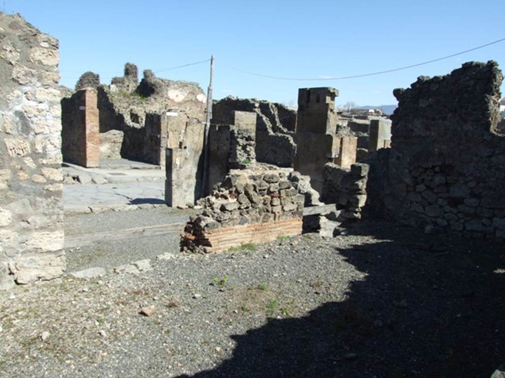 VIII.5.9 Pompeii. March 2009. Room 11. Looking north down step to Shop at VIII.5. 11 and linked to VIII.5.12
