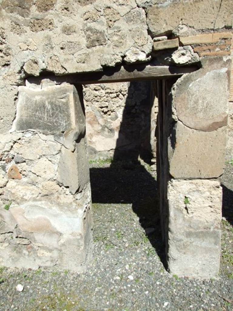 VIII.5.9 Pompeii. March 2009. Doorway to Room 23, Triclinium, in the north wall of Room 20.