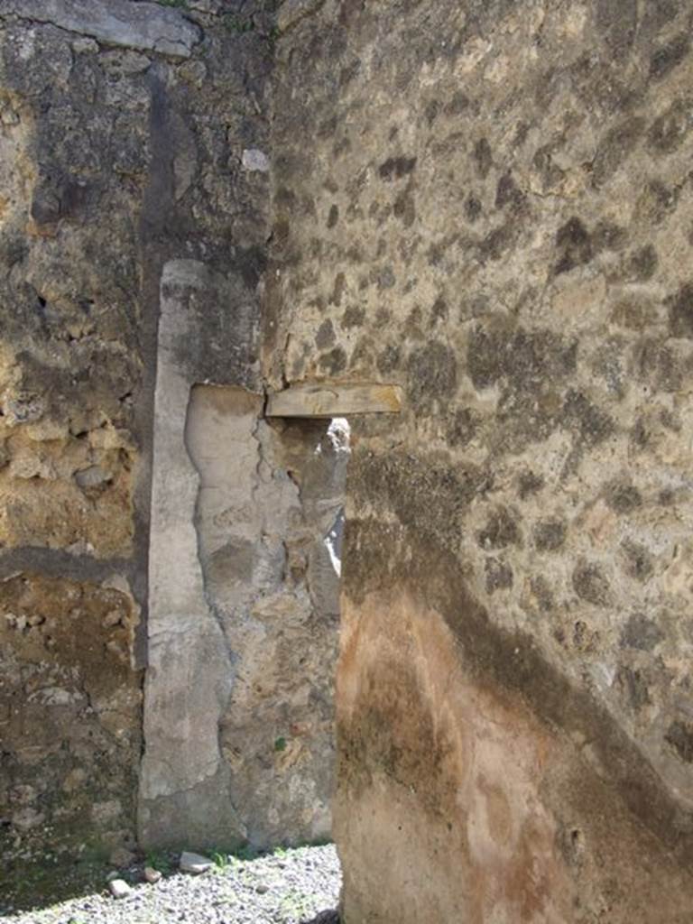 VIII.5.9 Pompeii. March 2009. Room 23. South wall, with small door in south east corner.