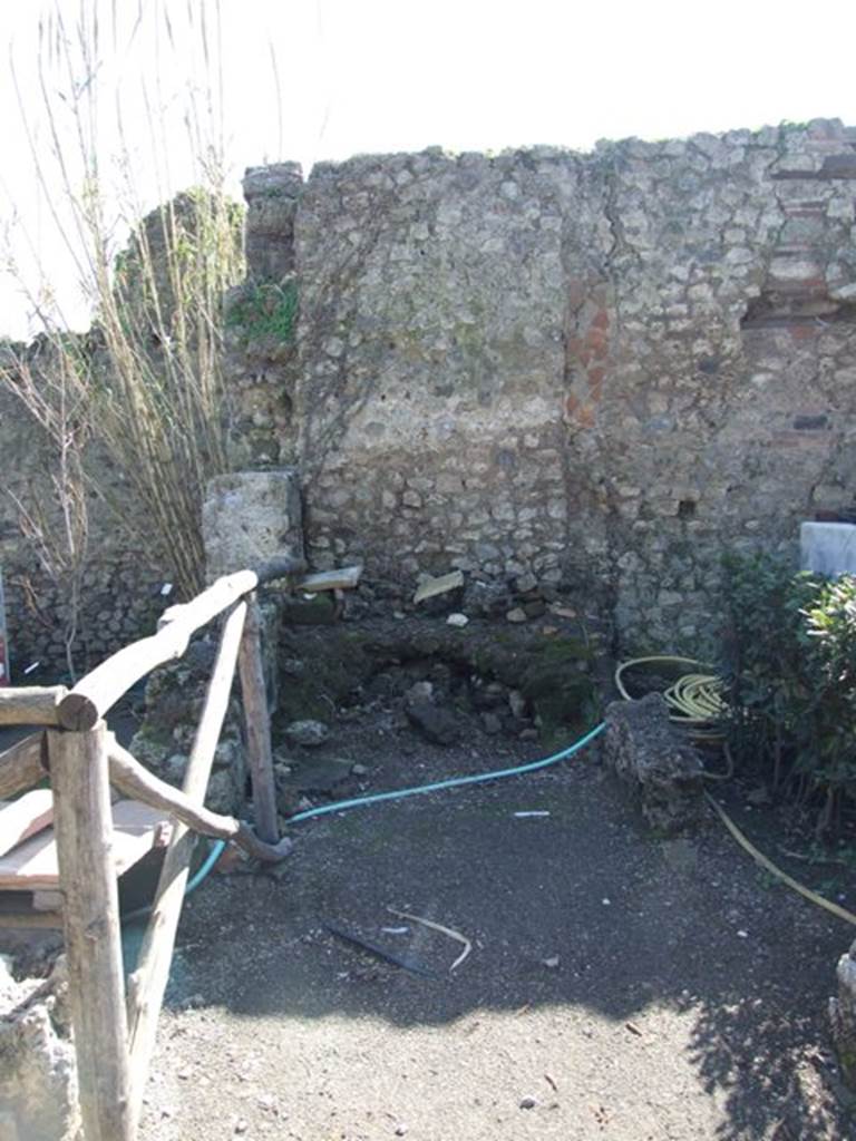 VIII.5.15 Pompeii. March 2009. Room 3, south side of remains of kitchen, with hearth.
