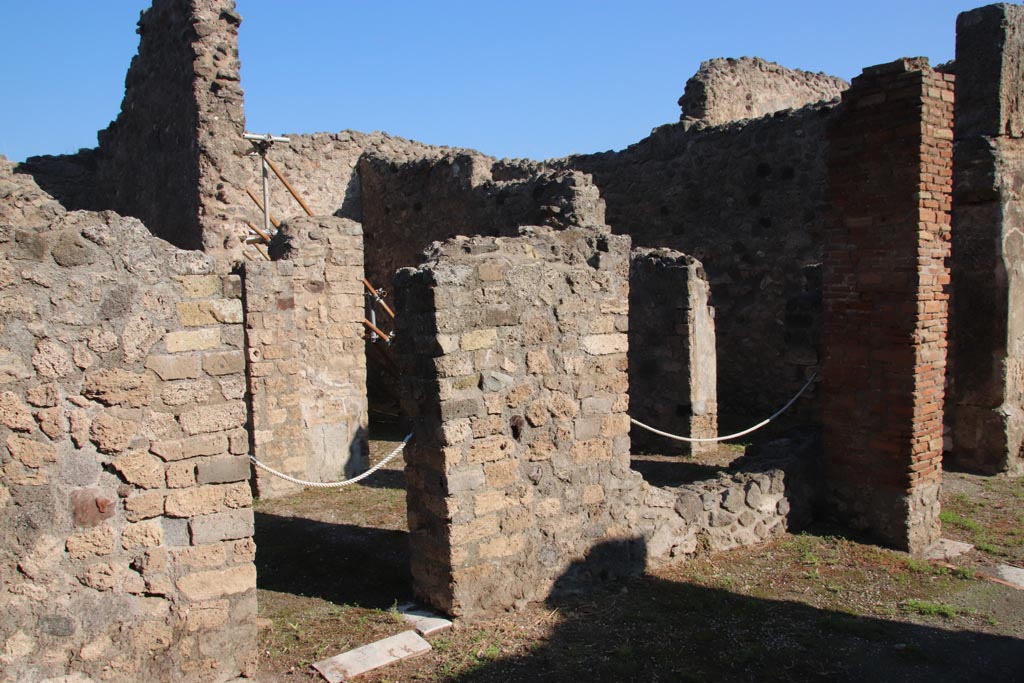 VIII.5.16 Pompeii. October 2022.
Looking north-east towards doorway to corridor 2, and window into anteroom of room 3, from north side of portico. Photo courtesy of Klaus Heese.