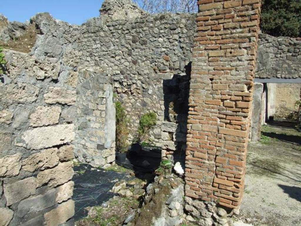 VIII.5.16 Pompeii. March 2009. Looking through window of anteroom of room 3. According to Mau, this dining room with an anteroom had an altar for libations. He noted that a fixed altar had been found in only one instance (up until 1893?) in a small dining room in the VIIIth region, at VIII.5.16. The front area of the dining room was set off as an anteroom, and in this was placed an altar of tufa. The other altars found had been small, moveable altars, such as those of terracotta and bronze, often found during excavation. See Mau, A., 1907, translated by Kelsey, F. W., Pompeii: Its Life and Art. New York: Macmillan. (p. 264).