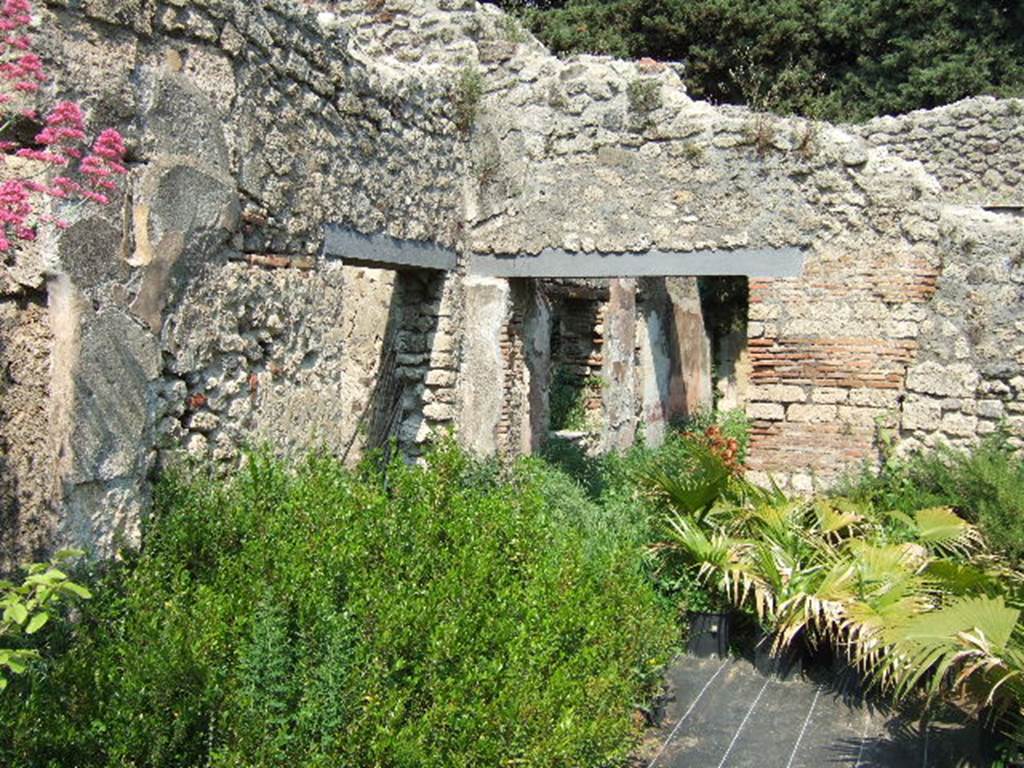 VIII.5.16 Pompeii. May 2006. Room 5, looking east towards doorway to room 6, and into room 7, on right.