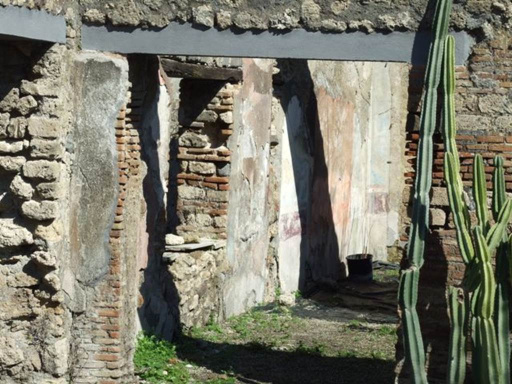 VIII.5.16 Pompeii. March 2009. Doorway to room 6, and leading into room 7, looking along north wall.