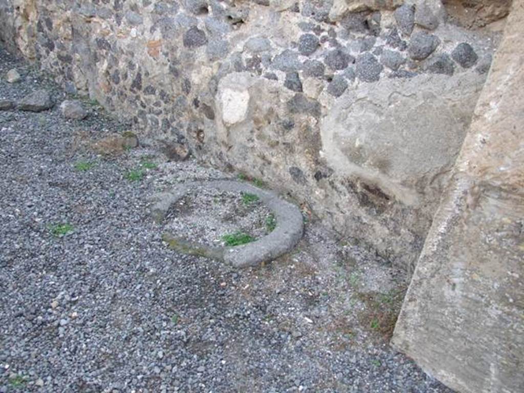 VIII.5.21 Pompeii. Shop and room. December 2007. Cistern or well head next to west wall.