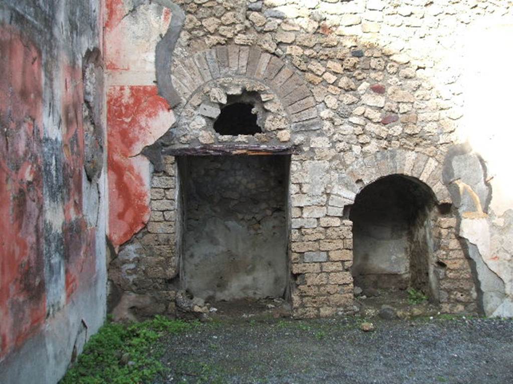 VIII.5.24 Pompeii. December 2004. Room 13, two recesses in the north wall, under the stairs to upper floor.