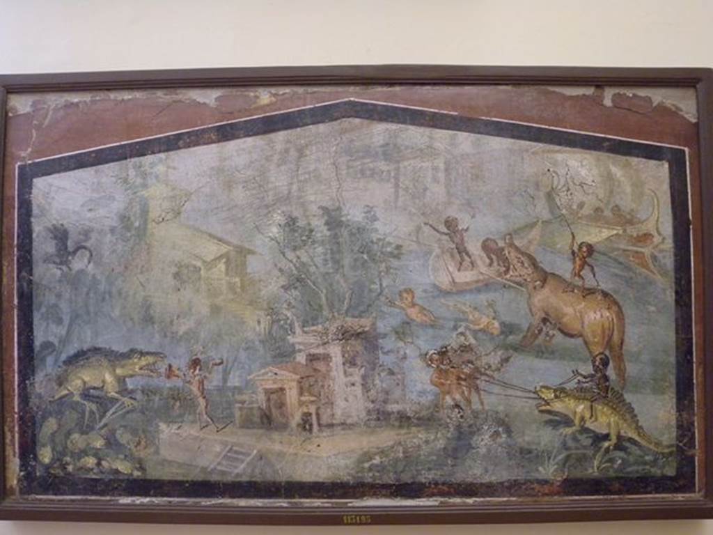 VIII.5.24 Pompeii. Wall painting of Pygmies in a Nile Scene. From a low wall connecting peristyle columns in VIII.5.24.
Now in Naples Archaeological Museum. Inventory number 113195.