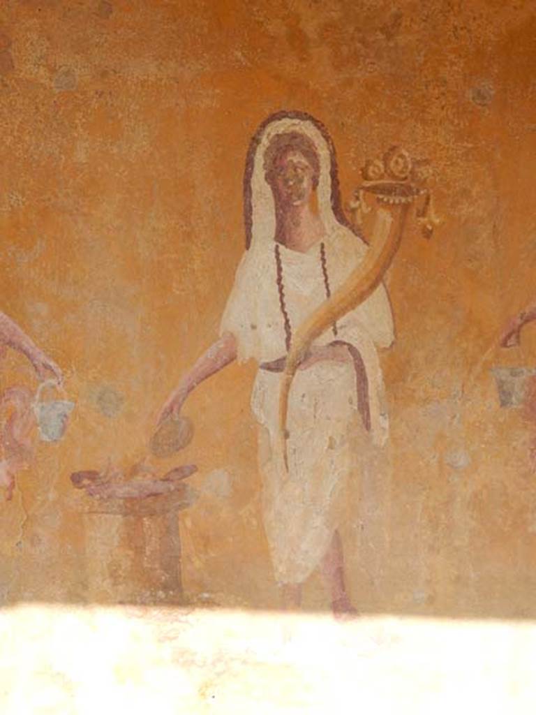 VIII.5.37 Pompeii. May 2017. Room 1, Genius making an offering, detail from lararium painting, after restoration. Photo courtesy of Buzz Ferebee.
