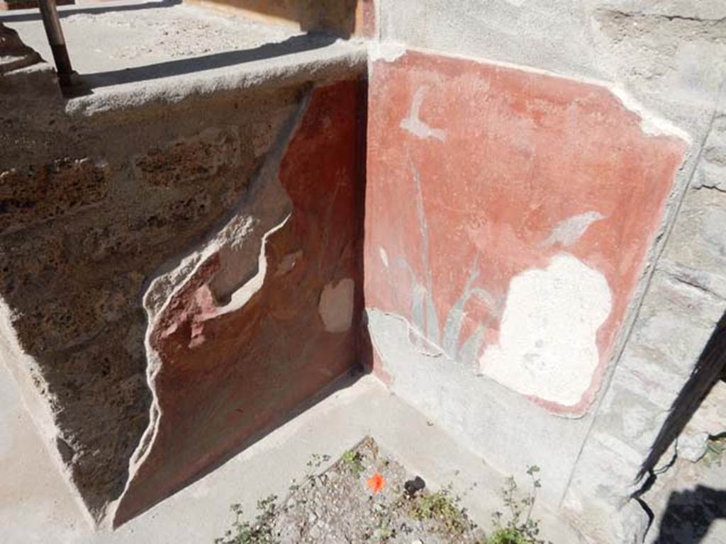 VIII.5.37 Pompeii. May 2017. Room 1, south side of podium of lararium, with remains of painted birds and plants decoration. Photo courtesy of Buzz Ferebee.