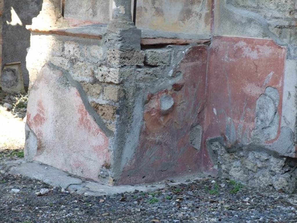 VIII.5.37 Pompeii. March 2009. South side of Podium of Lararium, with remains of painted plant decoration.