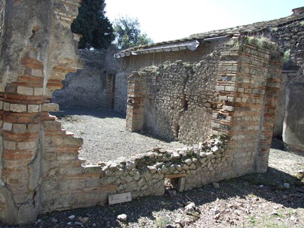 VIII.5.37 Pompeii. March 2009. Room 10, tablinum from garden area, looking south through window towards the west wall.
